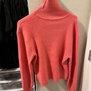 Pink turtleneck sweater
